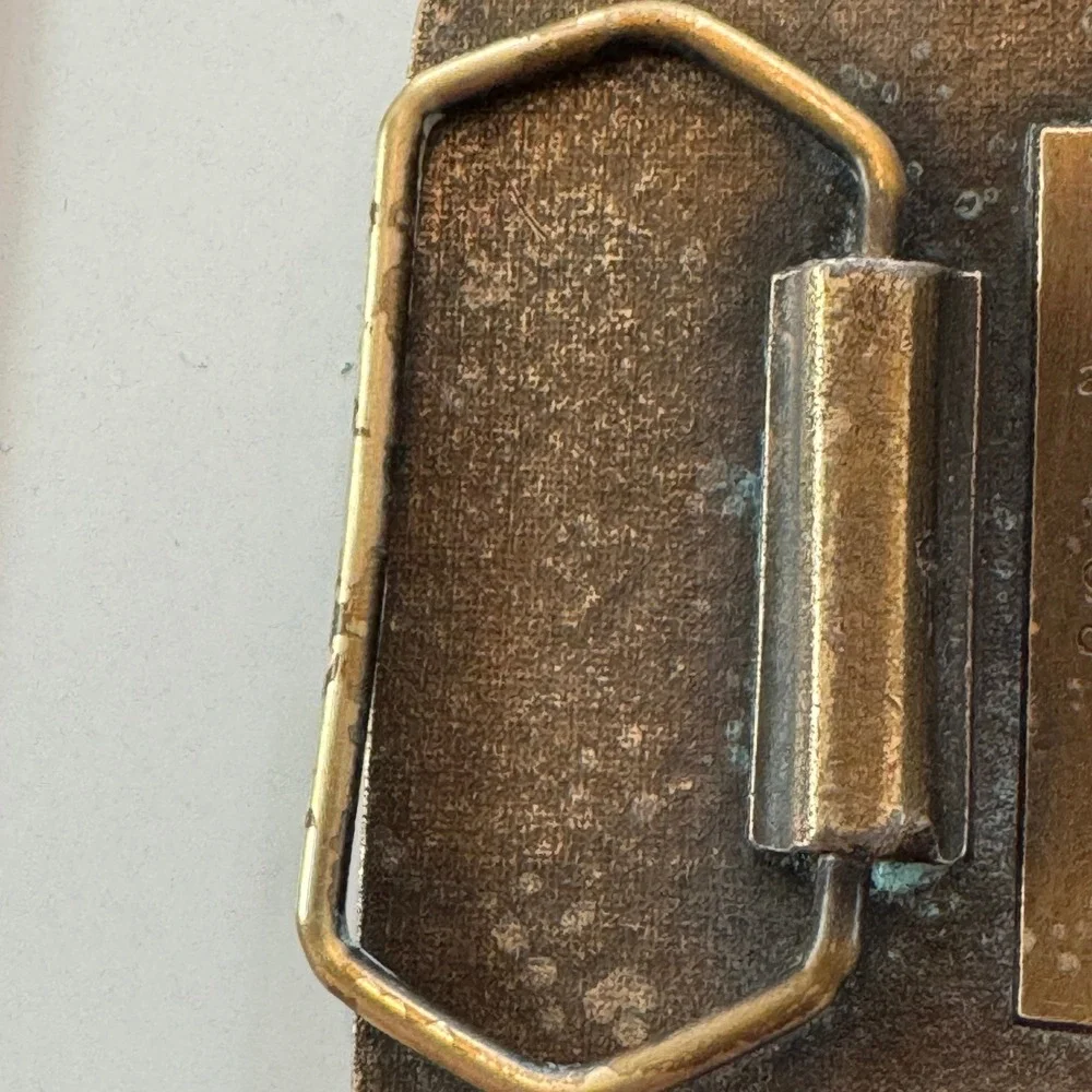 John Deere vintage brass
